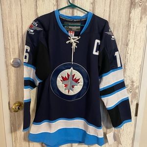 Winnipeg Jets official NHL jersey with tags. Size Large.